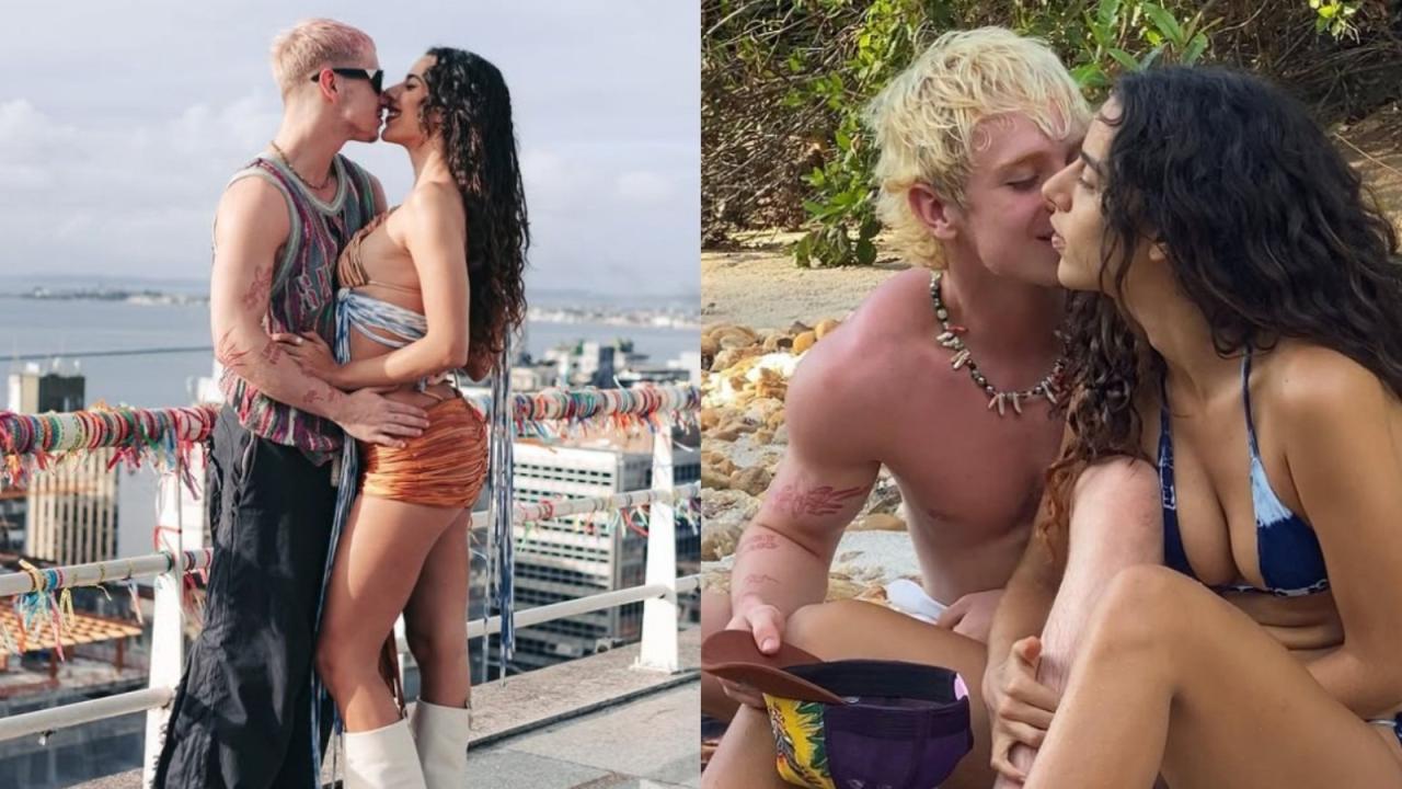 Homem e mulher se beijando na praia. É o Juliano Floss e a Marina Sena.