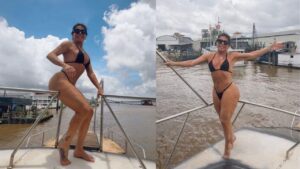 Gretchen usando biquíni preto no barco em um rio.