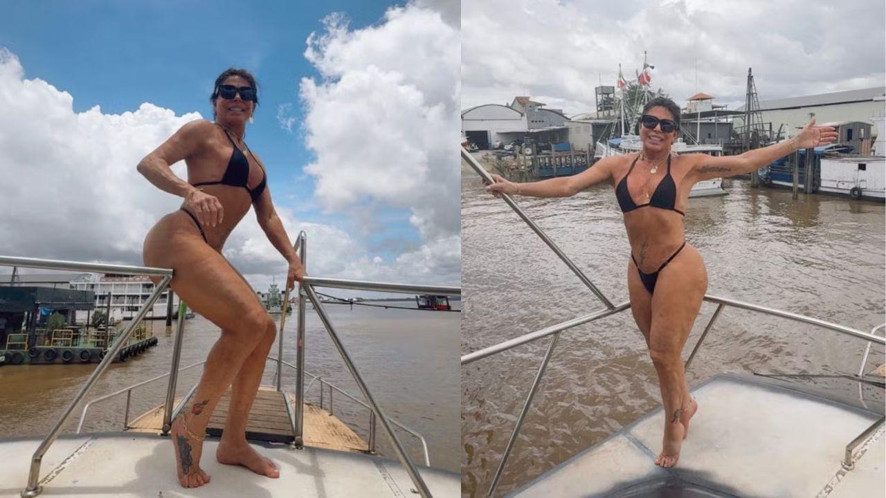 Gretchen usando biquíni preto no barco em um rio.