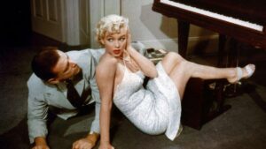 Foto mostra Marilyn Monroe em cena de filme.